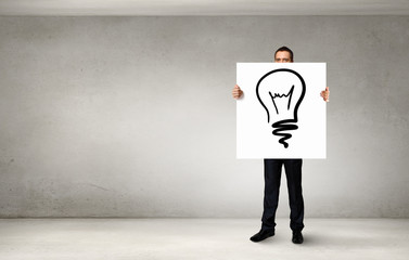 Businessman demonstrating banner with ideas