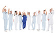 © Andrey Popov - Multiethnic Medical Team Standing With Arms Raised