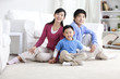 © Blue Jean Images - Young Chinese family with one son
