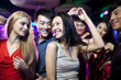 © Blue Jean Images - Stylish young people dancing in nightclub