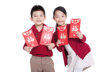 Wall Mural - Cheerful boy and girl holding red pockets