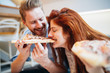 © NDABCREATIVITY - Couple sharing pizza and eating