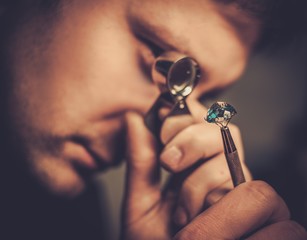 Wall Mural - Portrait of a jeweler during the evaluation of jewels.