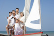 © Blue Jean Images - Happy family on a sailboat