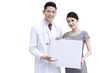 © Blue Jean Images - Doctor and young woman holding whiteboard