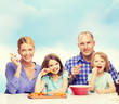 © Syda Productions - happy family with two kids eating at home