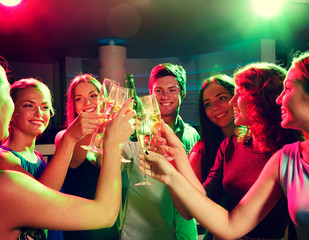 Poster - smiling friends with wine glasses and beer in club