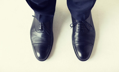 Sticker - close up of man legs in elegant shoes with laces