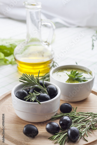 Marinated Black Olive And Homemade Sauce Mayonnaise In Ceramic Pots Marinated Black Olive And Homemade Sauce Mayonnaise In Ceramic Pots With Parsley Rosemary And Olive Oil On Wooden Board Buy This