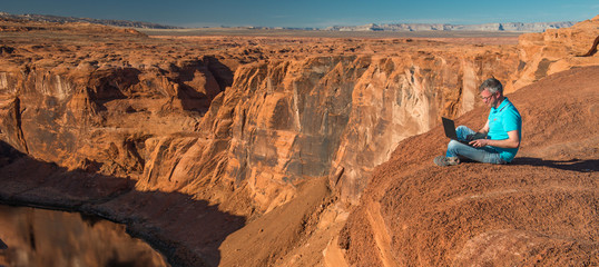 Wall Mural - Man at work in a canyon