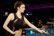 © Couperfield - Young nice brunette lady gaming in casino