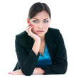 © iPortret - Serious looking businesswoman with hand on cheek