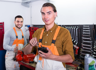 Two mechanics in workshop