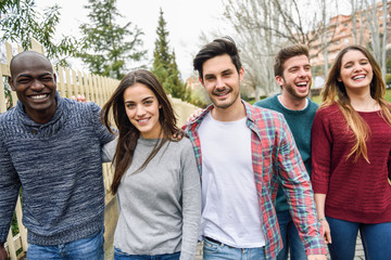 group of friends having fun together outdoors