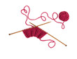 Knitting pattern on wooden needles of woolen threads red color