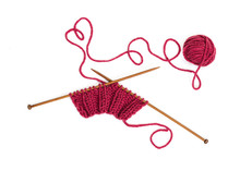 Knitting Pattern On Wooden Needles Of Woolen Threads Red Color