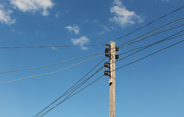 top of electrical wooden pole against the sky