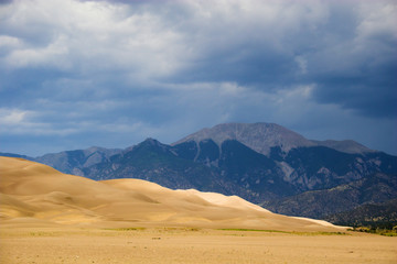 Wall Mural - Thunderstorm over sand dunes