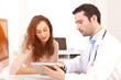 © Production Perig - Doctor using tablet to inform patient
