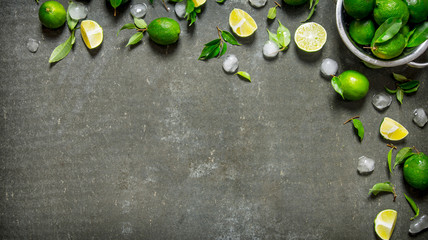 Sticker - Lime background. Limes with leaves and ice.