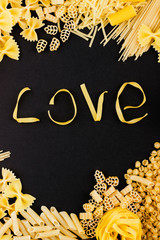 Wall Mural - Word Love from pasta on the black background