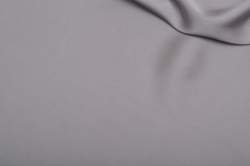 Shiny silver satin silk fabric background