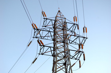 A tower with wires from power lines.