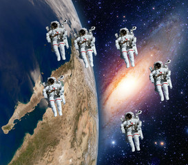 Wall Mural - many astronauts spaceman spacewalk space theme team walk milky way galaxy. elements of this image fu