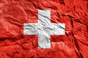 Wall Mural - Switzerland flag painted on crumpled paper background