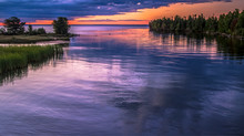 Lake Superior Twilight. The Sunset Over The Lake Superior Horizon Where The Tahqumenon River Empties Into The Great Lake. Tahquamenon Falls State Park. Paradise, Michigan.
