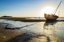 Stranded Ship Anchored On A Sunset In Madagascar