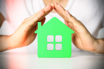 Poster - Male hands and house, closeup