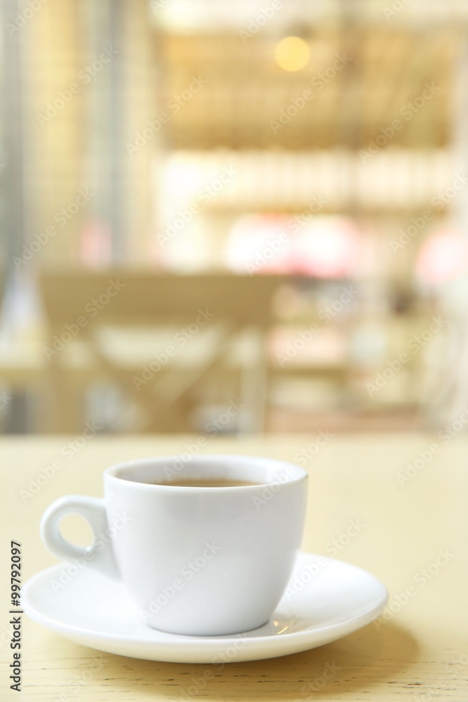 Cup of tasty coffee on cafe background