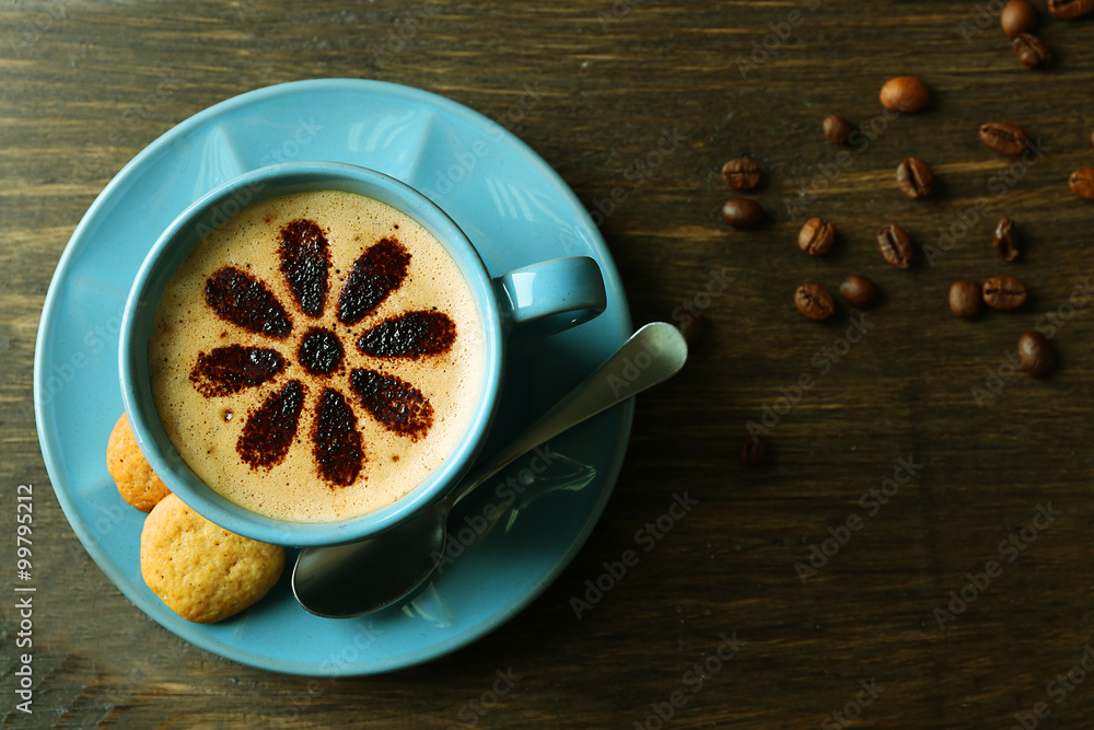 Cup of coffee on wooden background