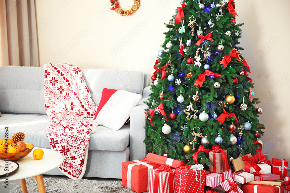 Christmas interior with fir tree and gifts