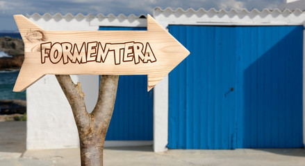 Wall Mural - wooden sign indicating to formentera