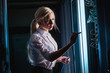 © agnormark - Young engineer businesswoman in server room