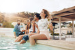 © Jacob Lund - Friends partying by poolside