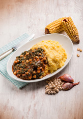 Canvas Print - porridge with chickpeas spinach and tomato sauce