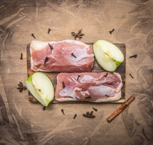 Raw Duck Breast With Cinnamon, Cloves And Apple On A Cutting Board On Wooden Rustic Background Top View