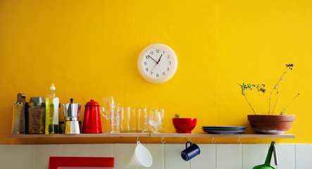 Yellow wall clock in the kitchen