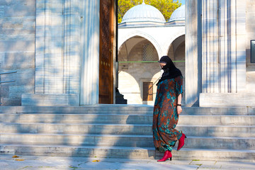 Wall Mural - Muslim Woman walking on Marble stairs of Mosque