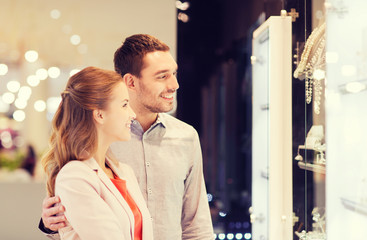 Wall Mural - couple looking to shopping window at jewelry store