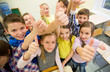 © Syda Productions - group of school kids showing thumbs up