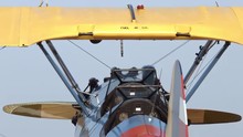 Tilt From Sky Down A View Of Upper Wing And Cockpit Of A Boeing Stearman Biplane.  Recorded In 4K, Ultra High Definition.