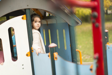 Wall Mural - Little girl at playground