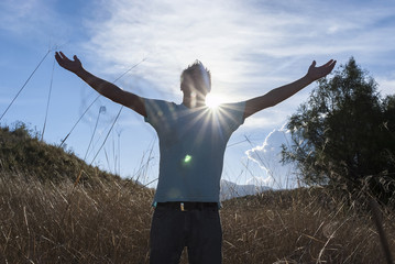 Wall Mural - Man praying outdoors