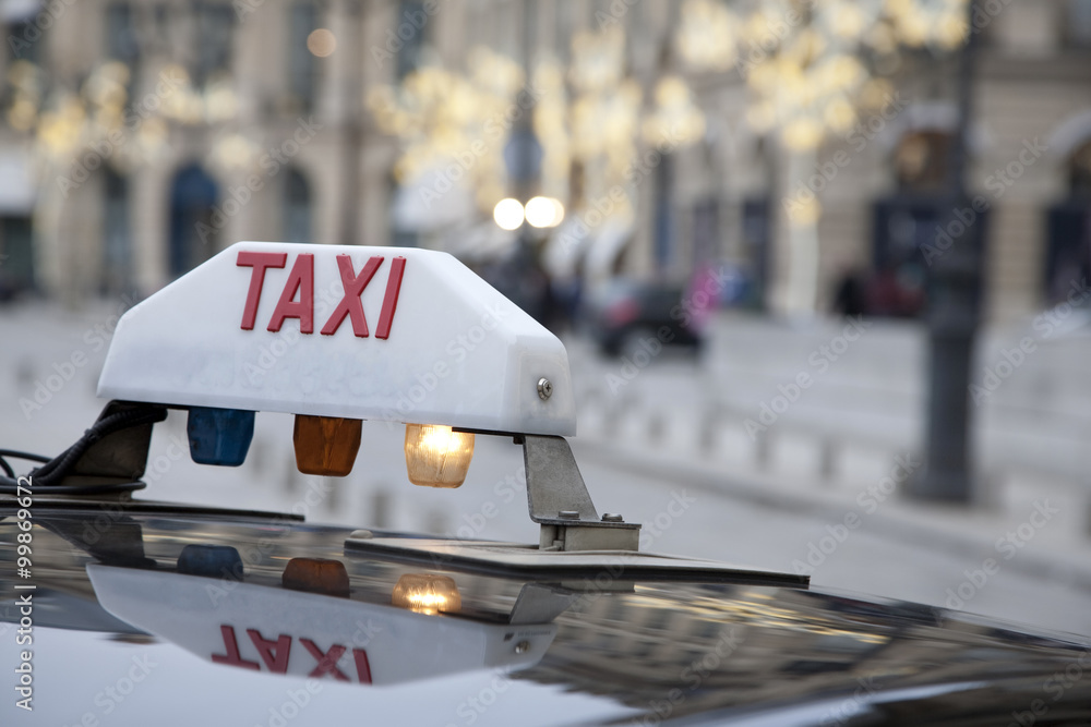 Parisian Taxi with Christmas Decoration in Background - obrazy, fototapety, plakaty 