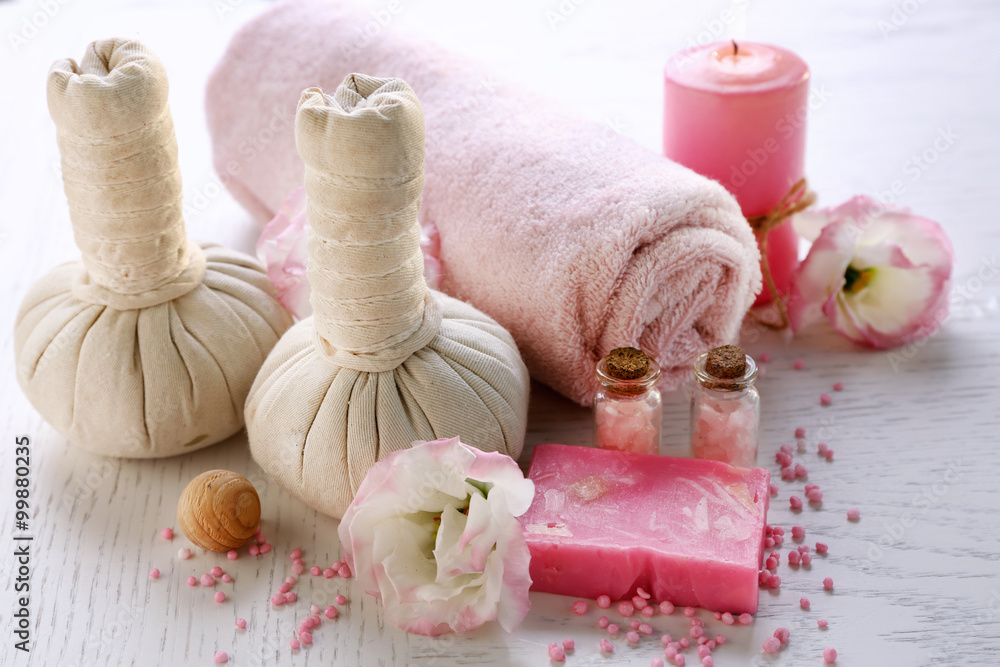 Beautiful composition of spa treatment on a white wooden table