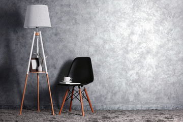 Wall Mural - Stylish conception with chair and lamp on grey background